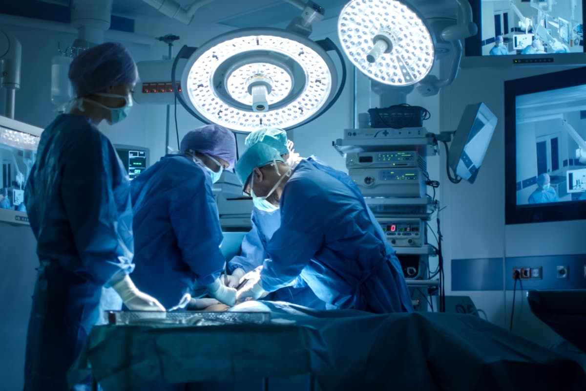 Medical Team Performing Surgical Operation in Modern Operating Room