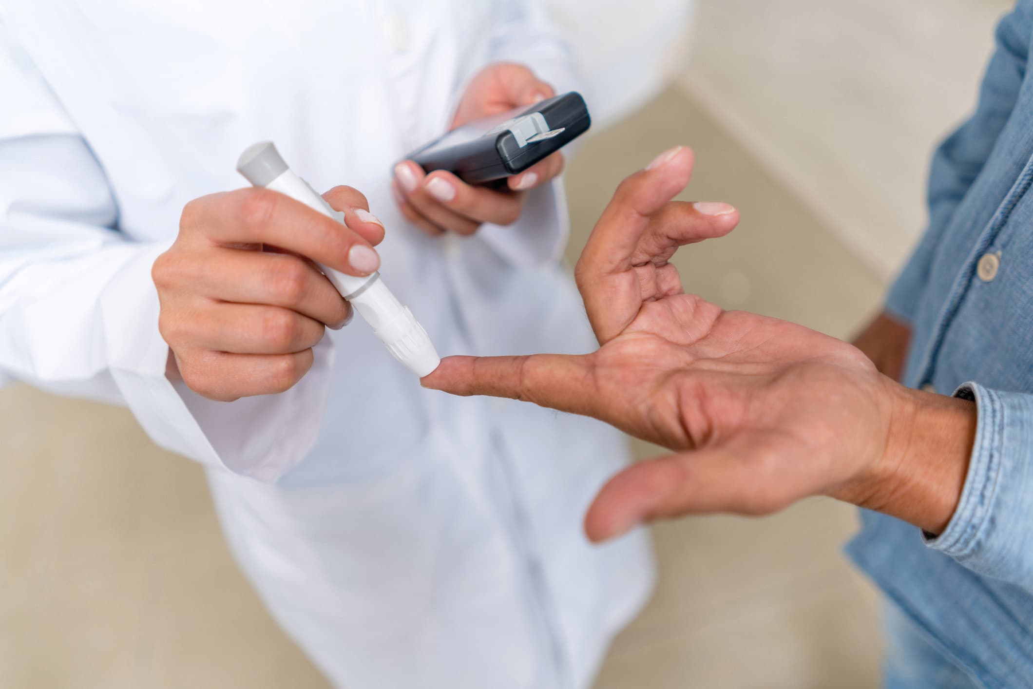 Man checking sugar level with glucometer