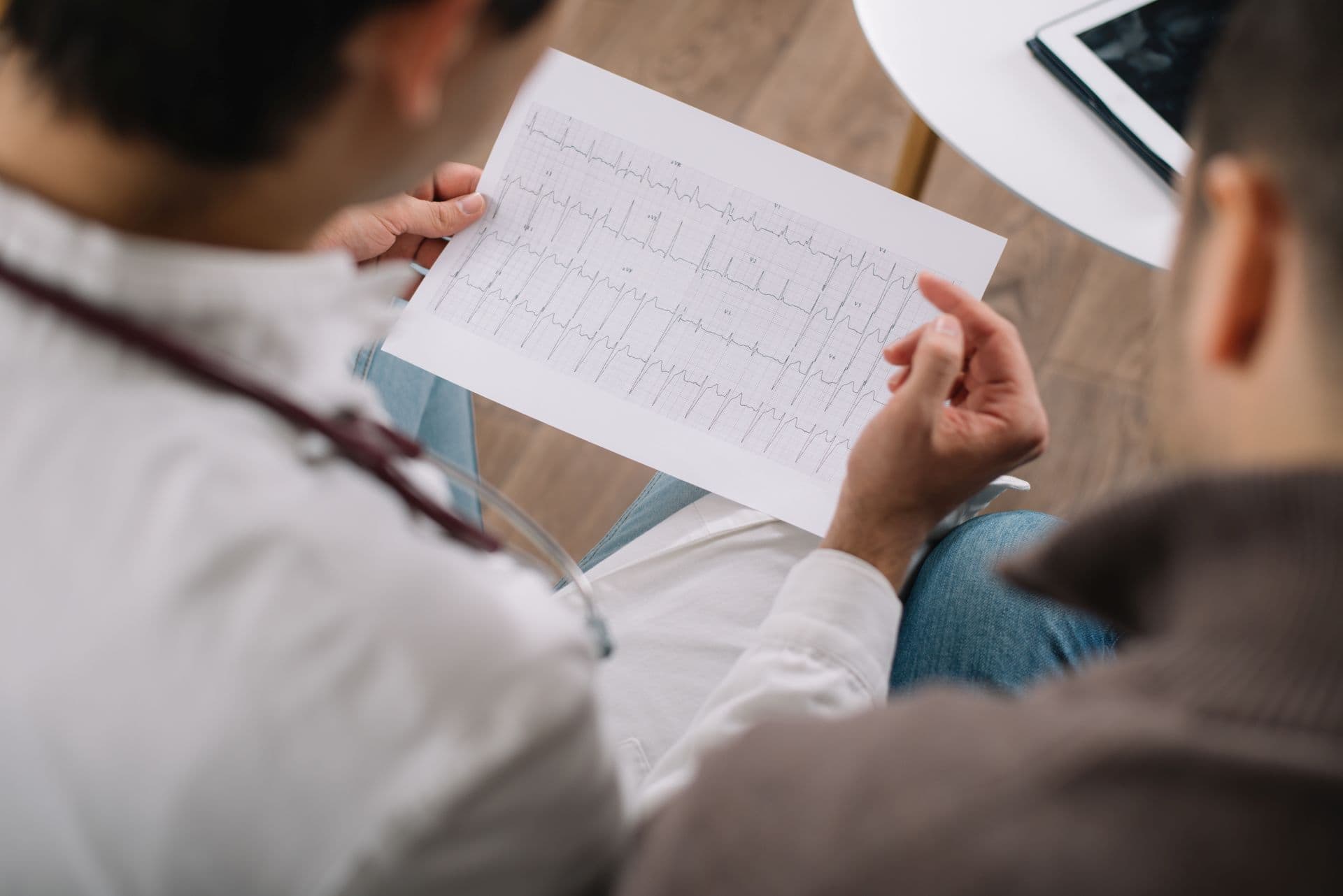 Doctor showing ECG results to a patient