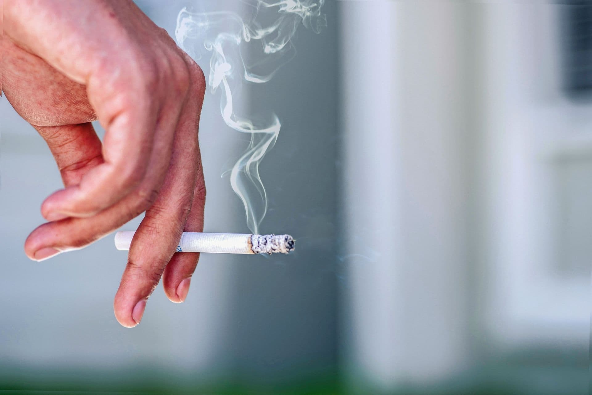 man smoking a cigarette