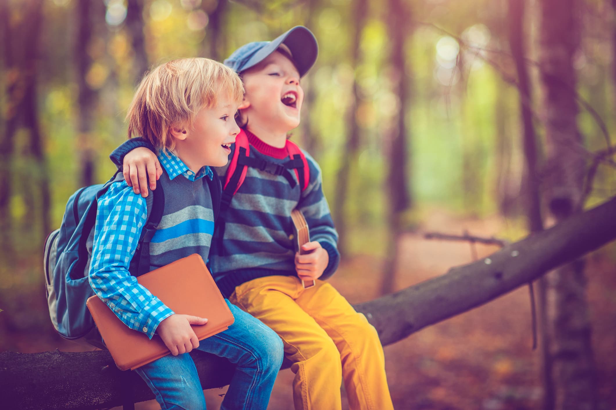 Little schoolboys in autumn