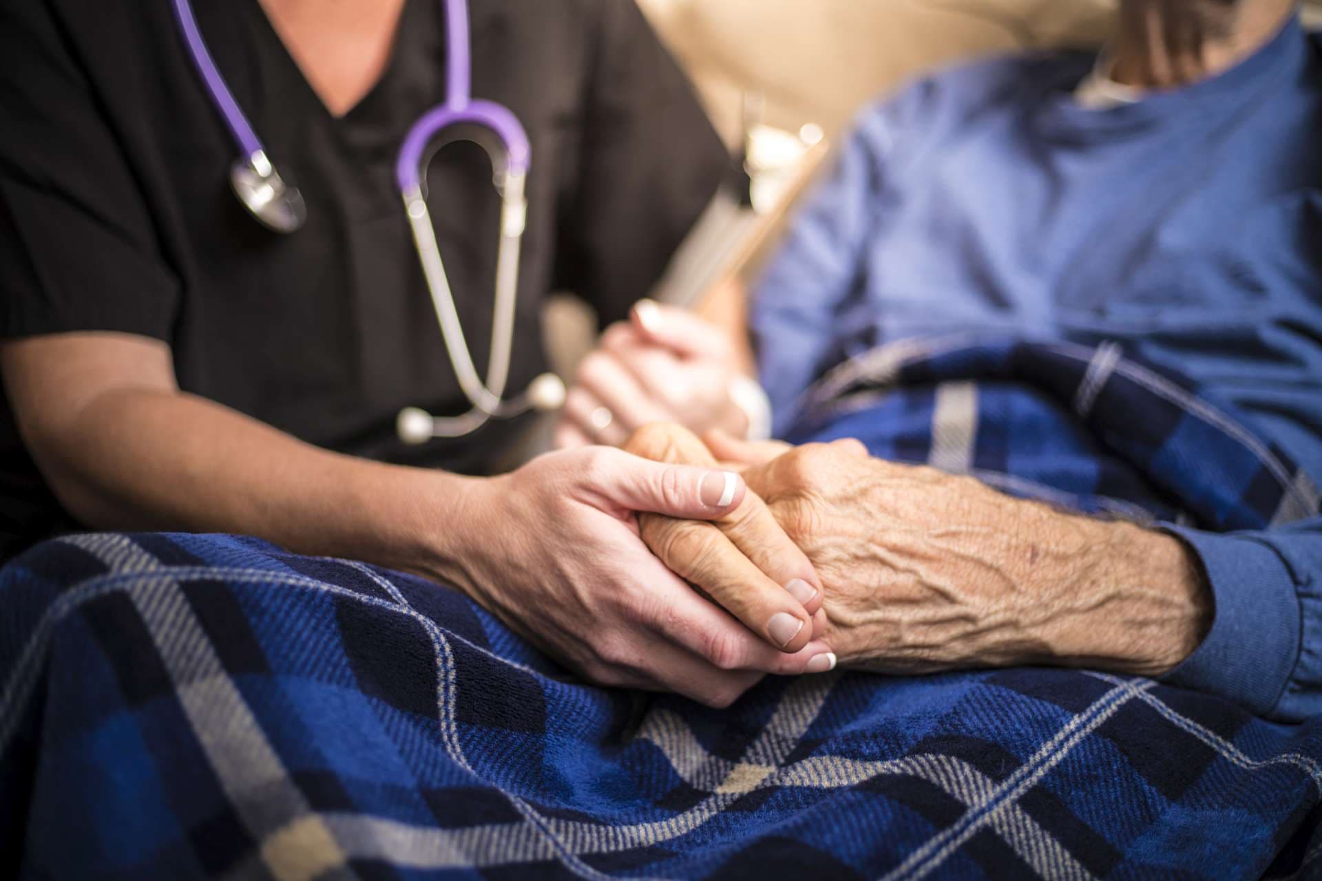 Hospice Nurse visiting an elderly male patient