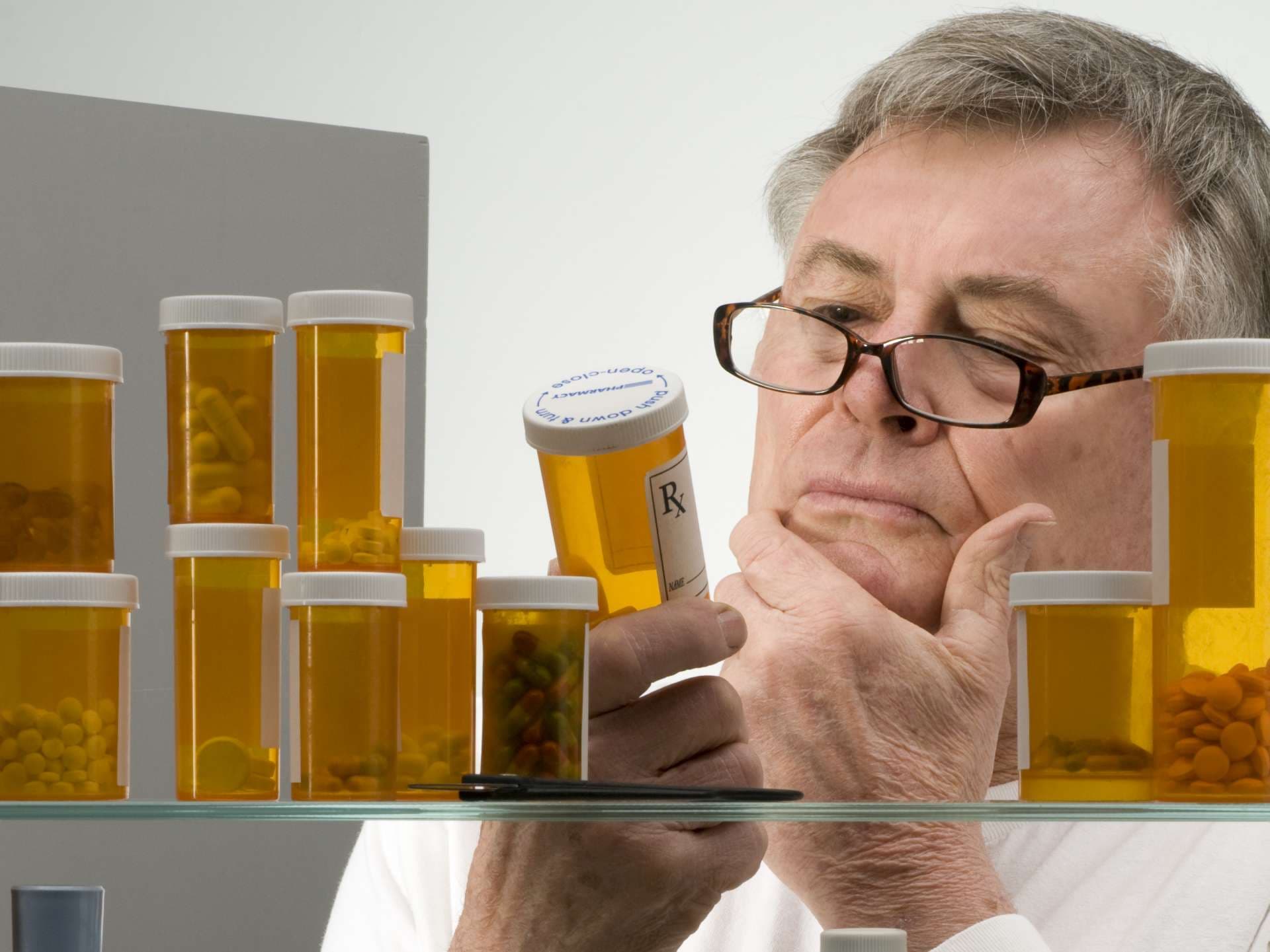 Senior checking his medications