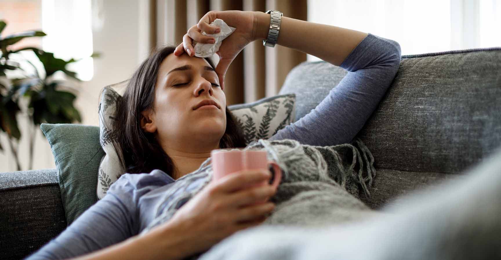 Sick woman lying in bed