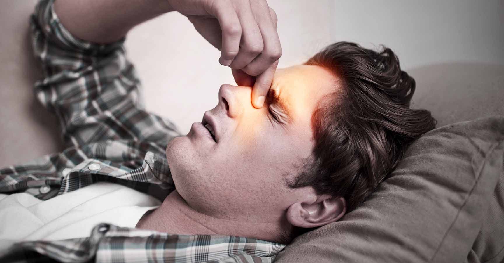 A young man holding his head in painhttp://195.154.178.81/DATA/i_collage/pi/shoots/785181.jpg