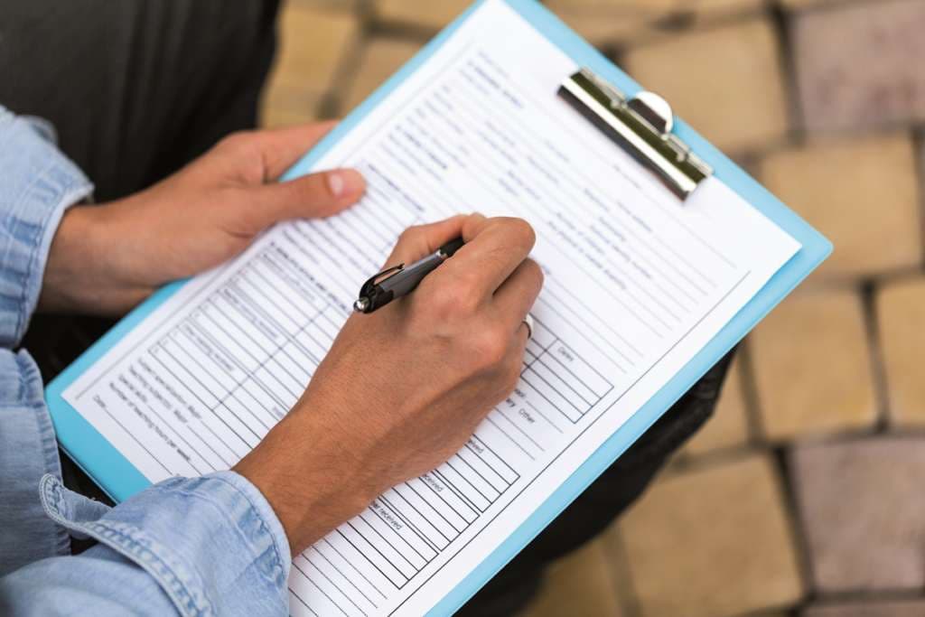 Closeup of a Person Filling a Track Record