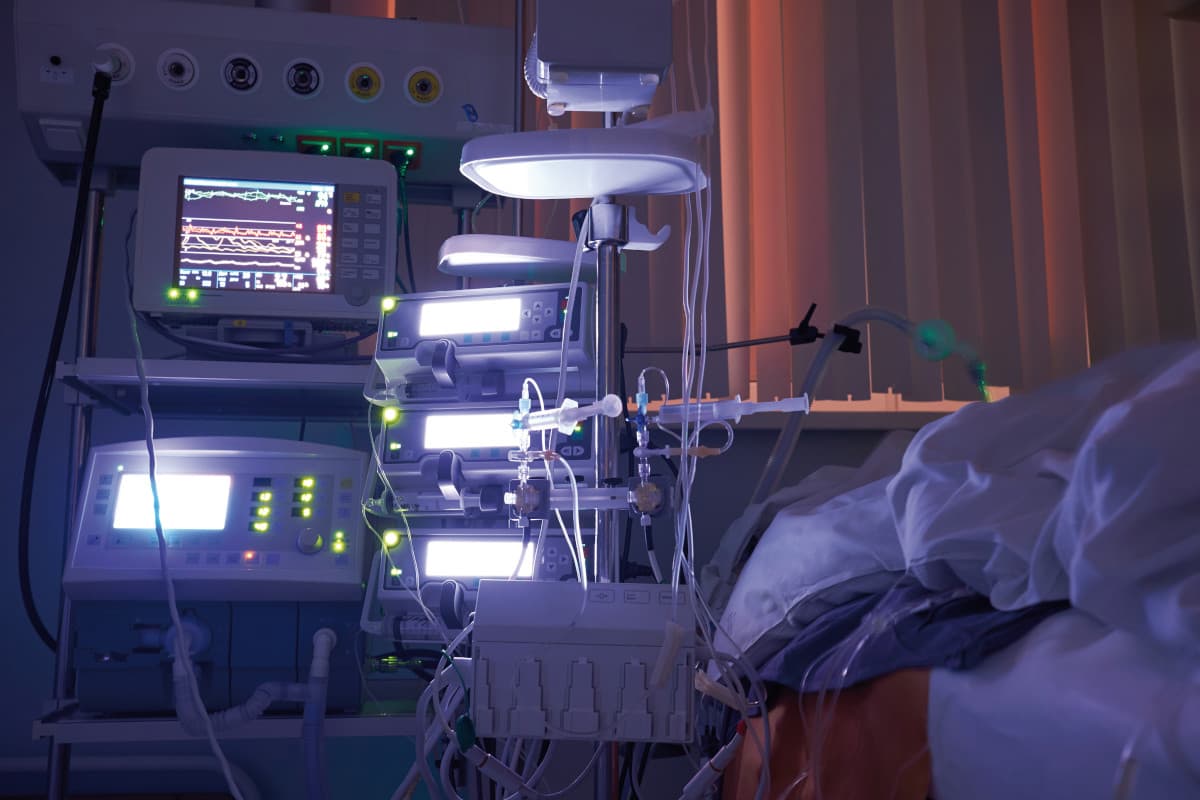 Glowing monitors in intensive care department. Nigth shift at icu, patient in critical state.