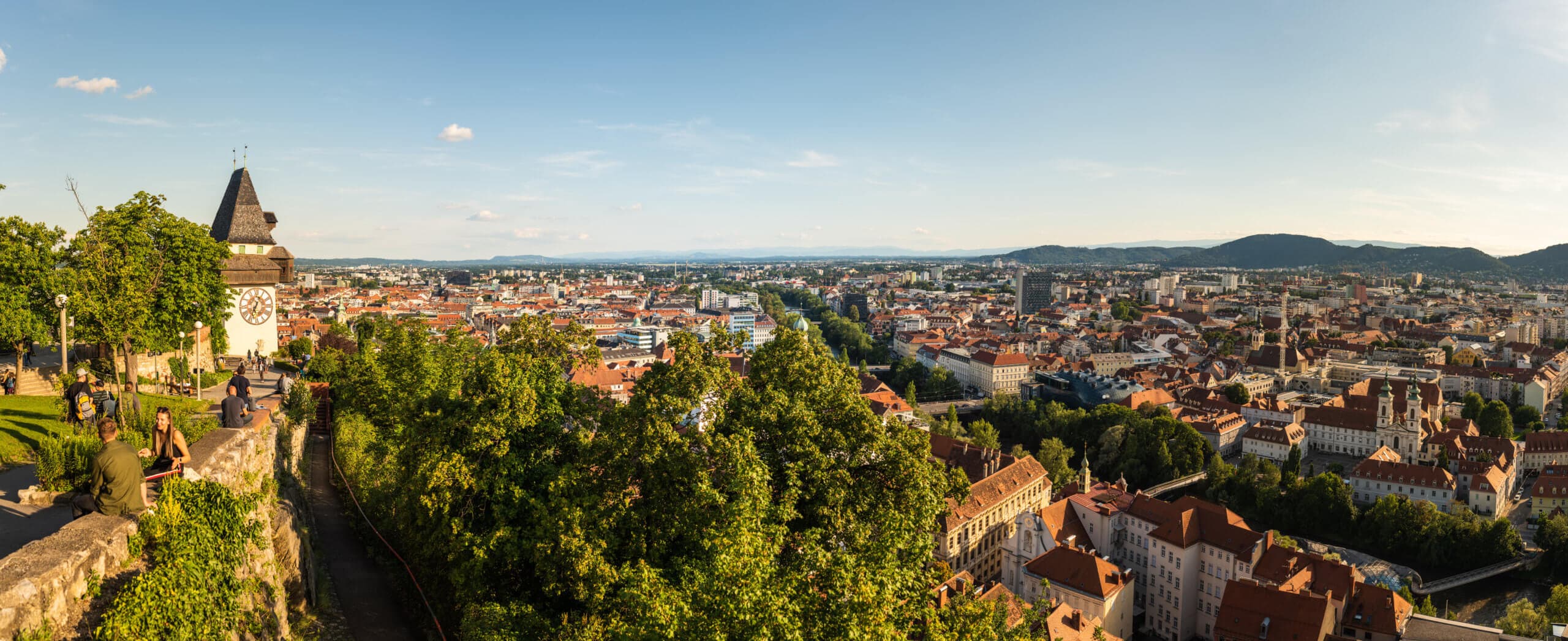 Graz, Austria - 13.07.2020: Panorama view from the top of schlossberg hill over the city