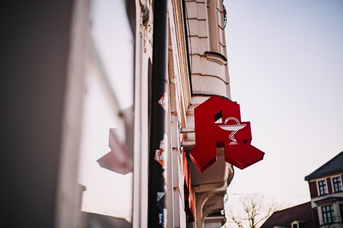 Sign for a German pharmacy (Apotheke) on new modern building facade of the hospital campus complex. March 2020