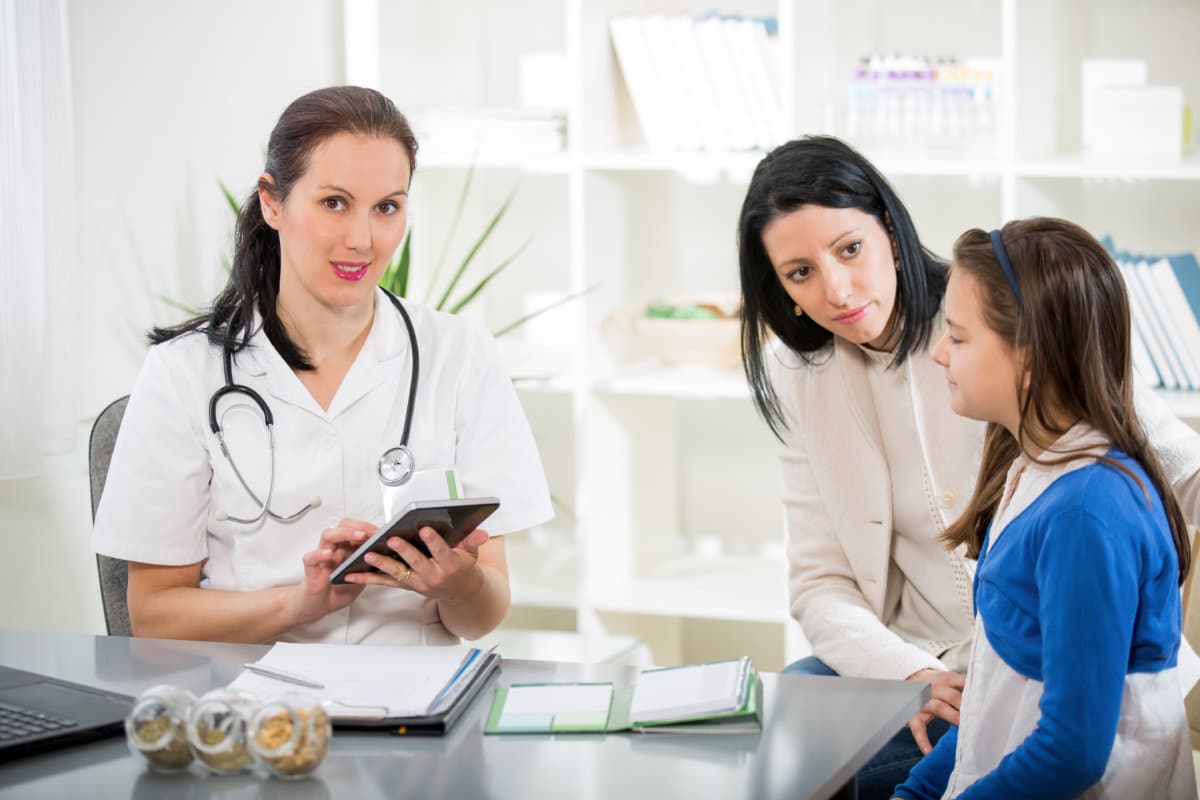 .Young woman and her daughter at the doctor homeopaths