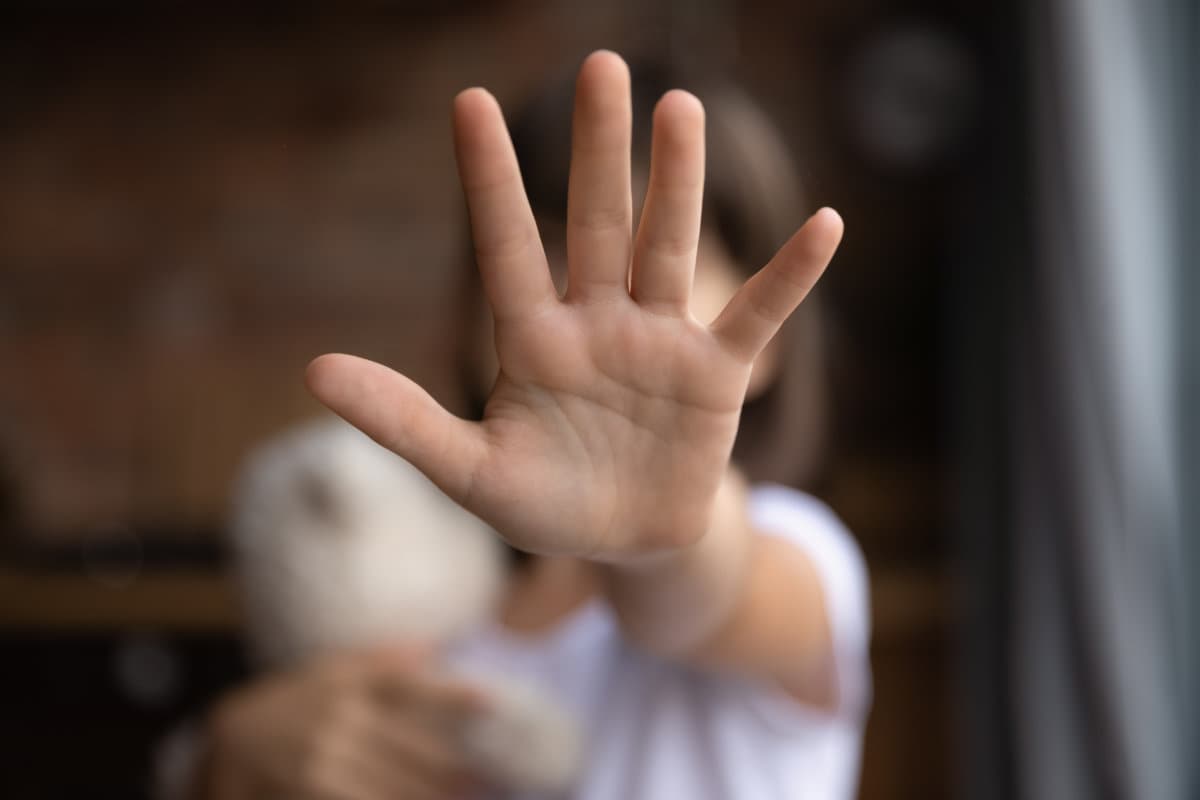 Close up of small girl show ho hand gesture