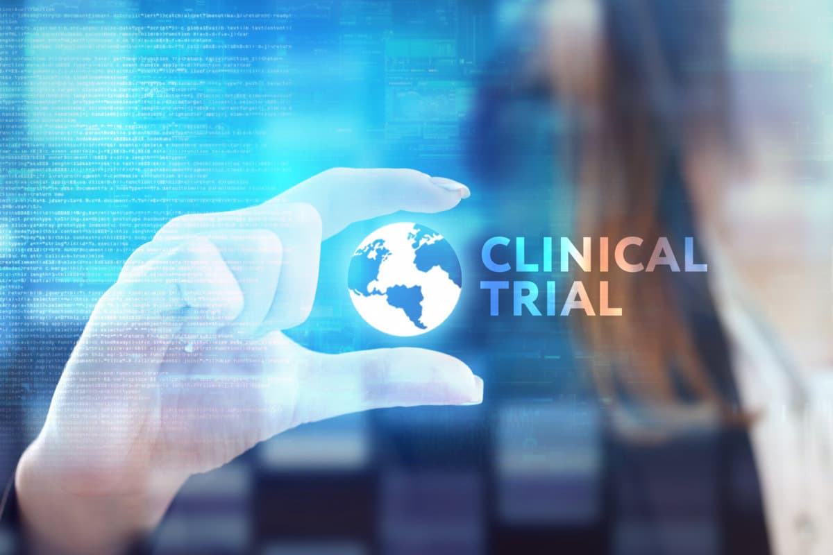 The concept of business, technology, the Internet and the network. A young entrepreneur working on a virtual screen of the future and sees the inscription: Clinical trial