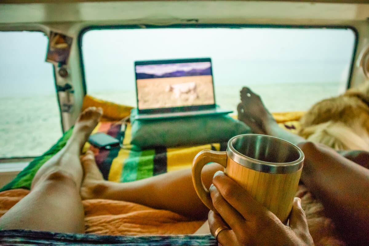 People drinking coffee and working on laptop from home