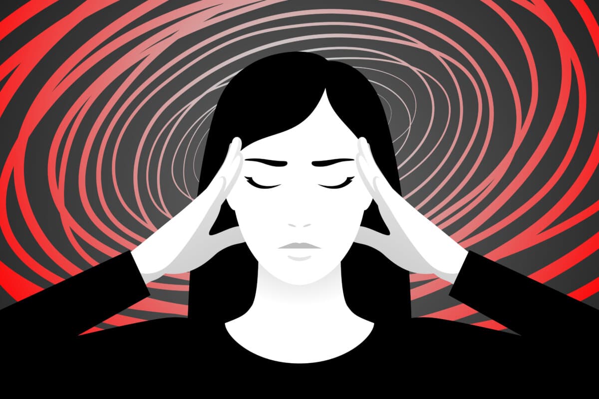 Unhappy woman is suffering from vertigo, feeling dizzy