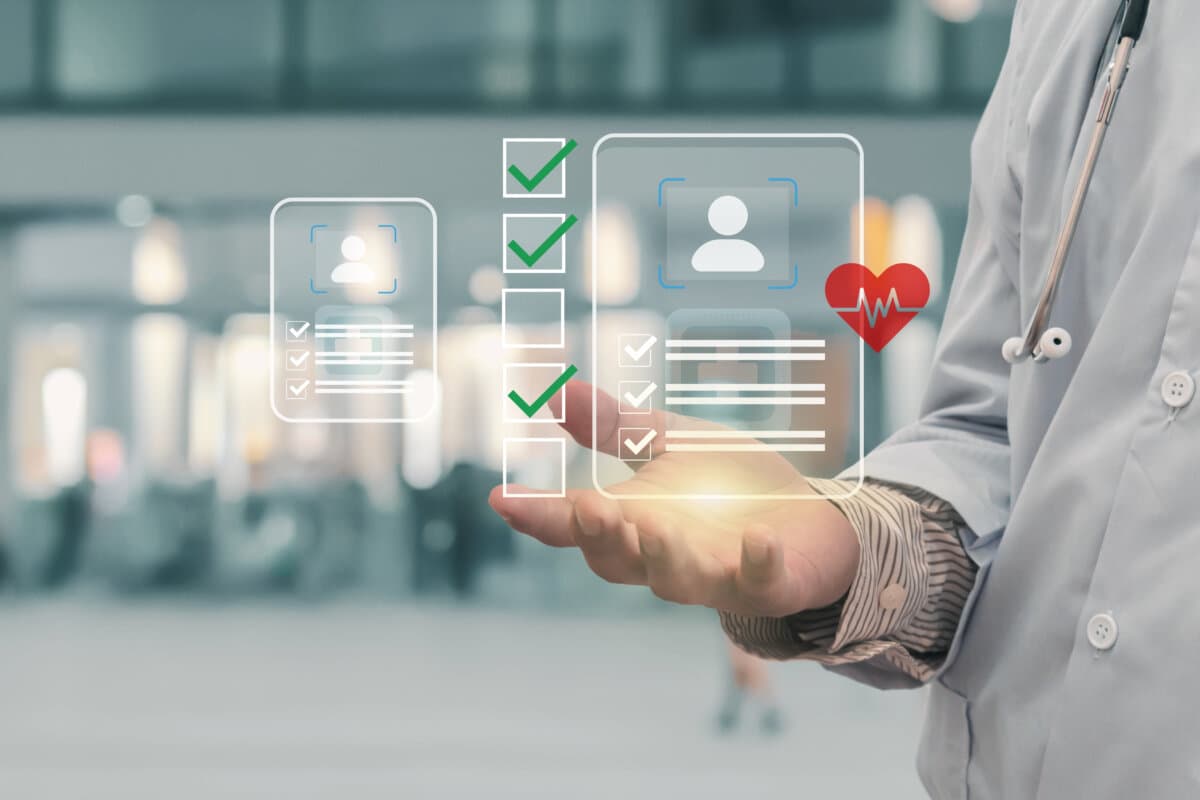 Doctor holding virtual screen displaying patient health data, showcasing digital healthcare technology and medical innovation