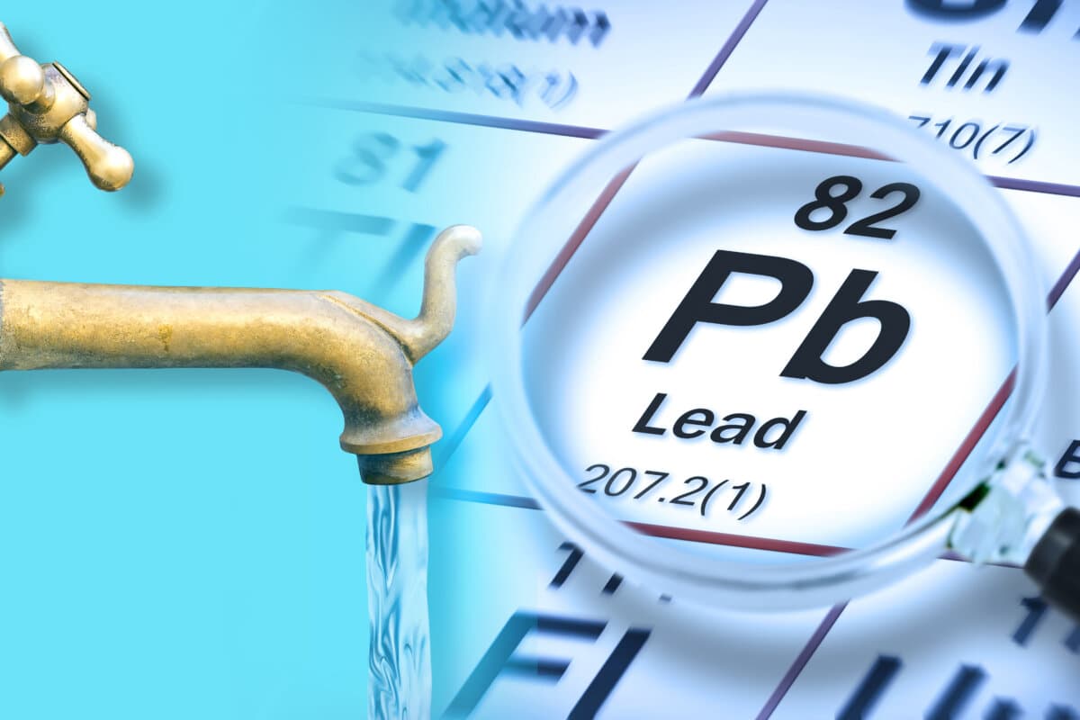 Presence of lead in drinking water - concept with the Mendeleev periodic table and old water brass faucet