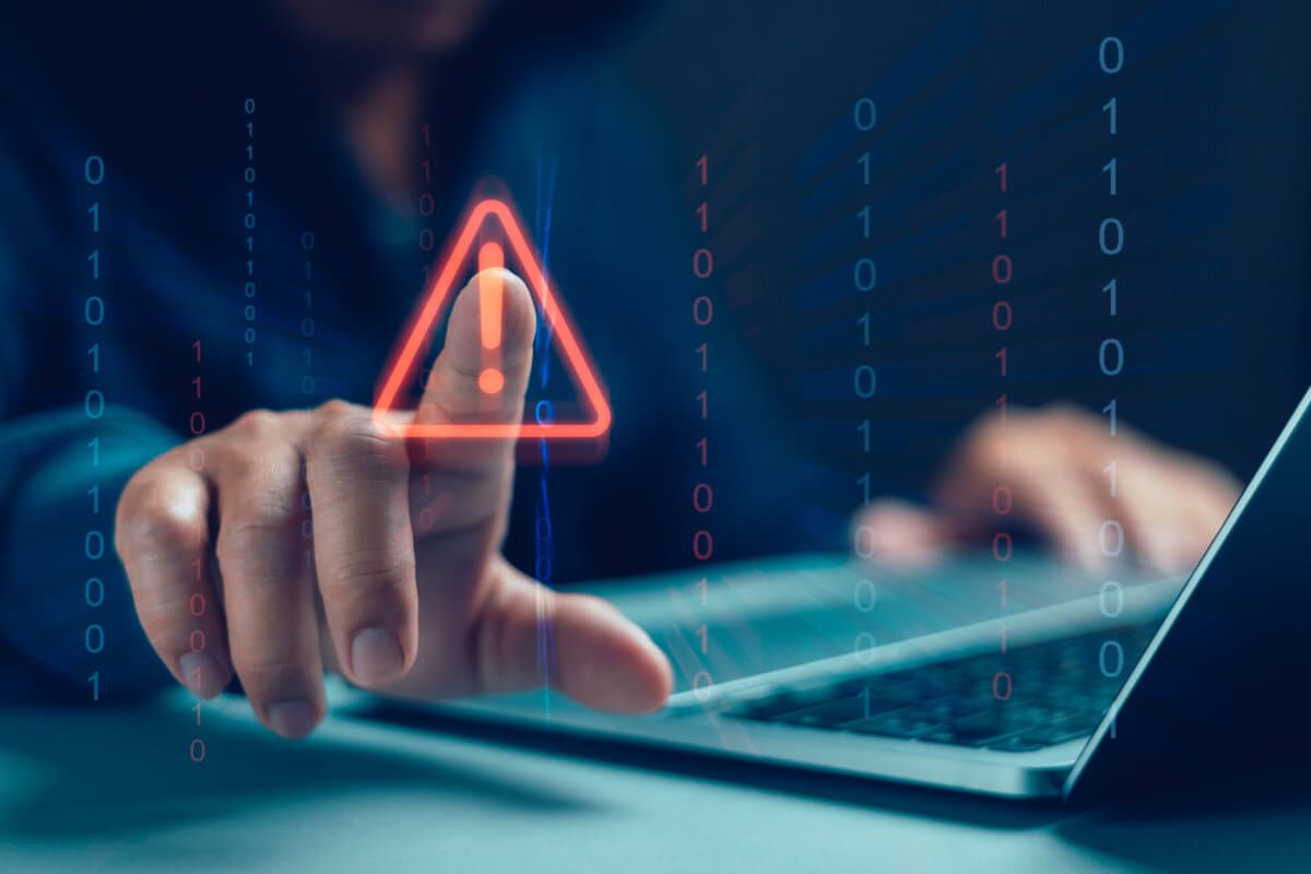 Concept of warning or alert, technology scam, user showing warning of access to software, virus, malicious cyber attack or