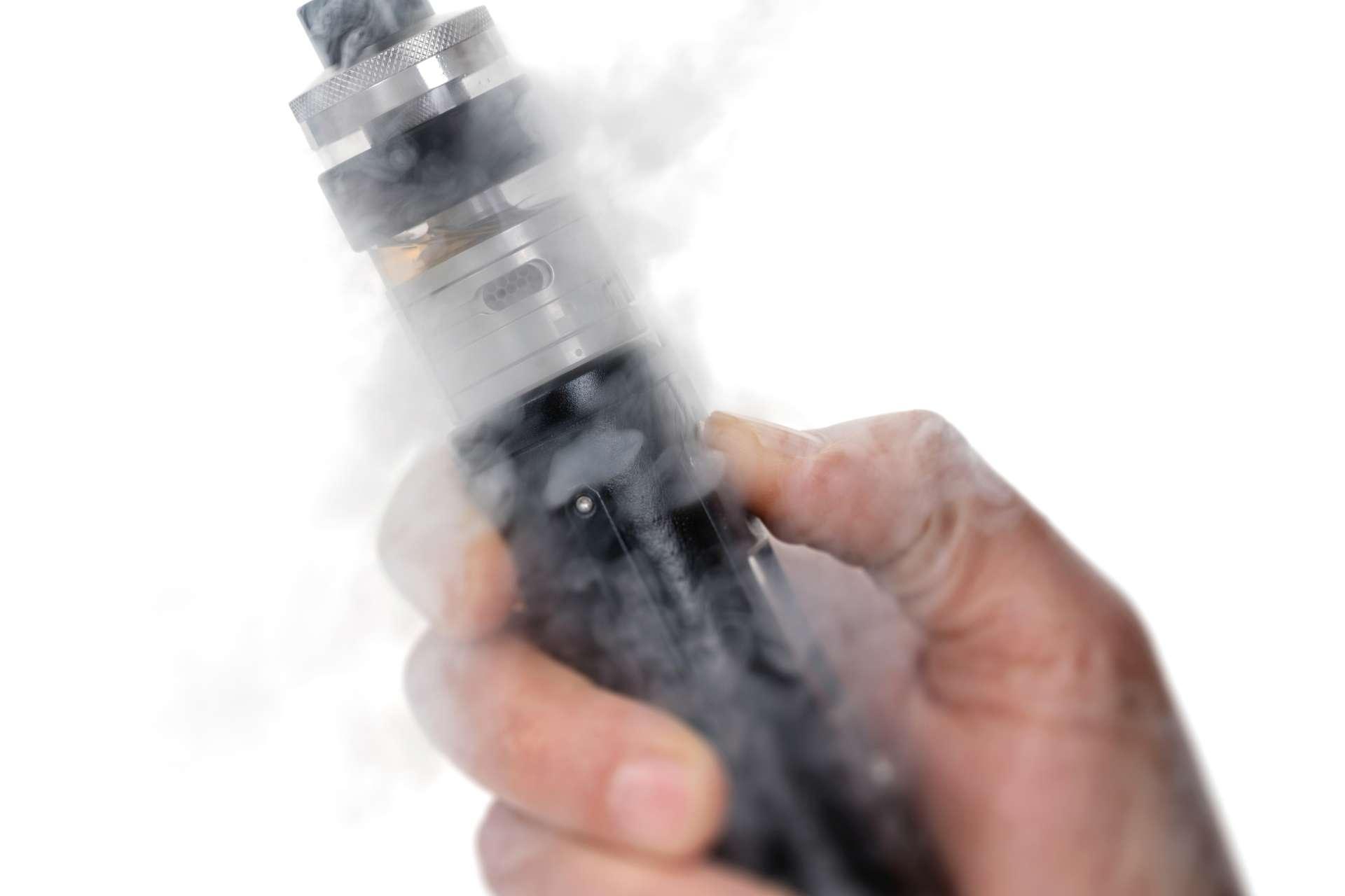 lectronic cigarette in the man's hand