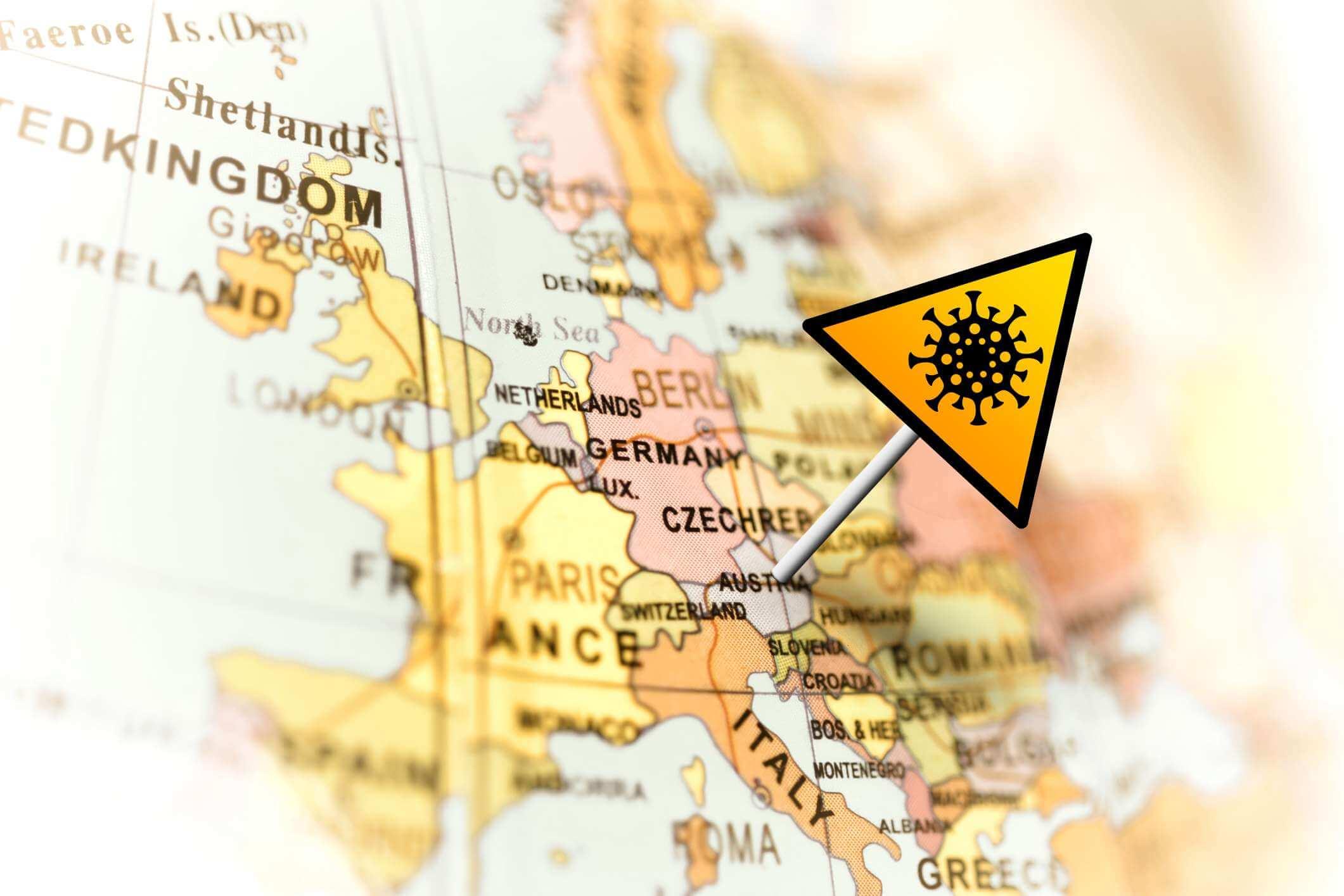 Gelbes Warnzeichen des Coronavirus in Österreich auf der Karte. Covid-19-Infektionskonzept.