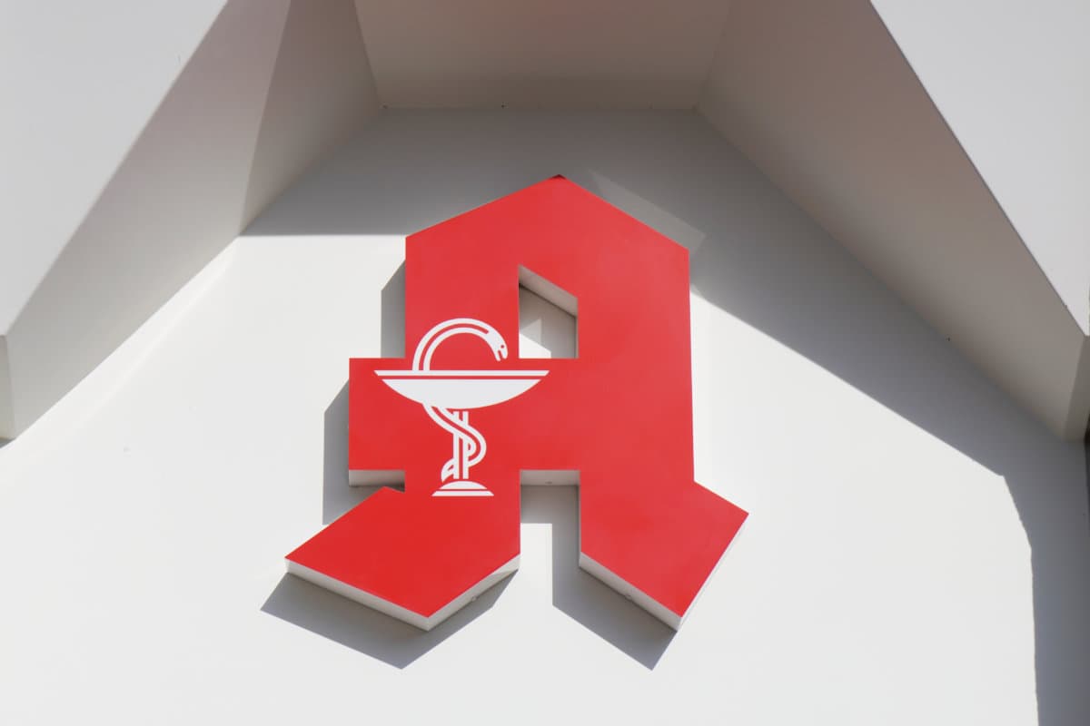 German Apotheke – which translates as pharmacy or drugstore – with red A logo sign in Hannover, Germany on March 16, 2020