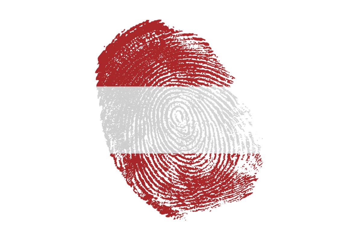 Human finger print in colors of national flag on white background. Austria