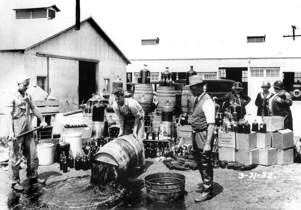Orange_County_Sheriff’s_deputies_dumping_illegal_booze,_Santa_Ana,_3-31-1932